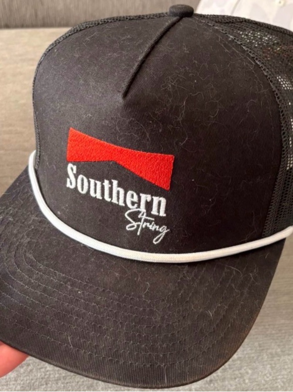 Southern String Black Trucker Hat with Red Logo